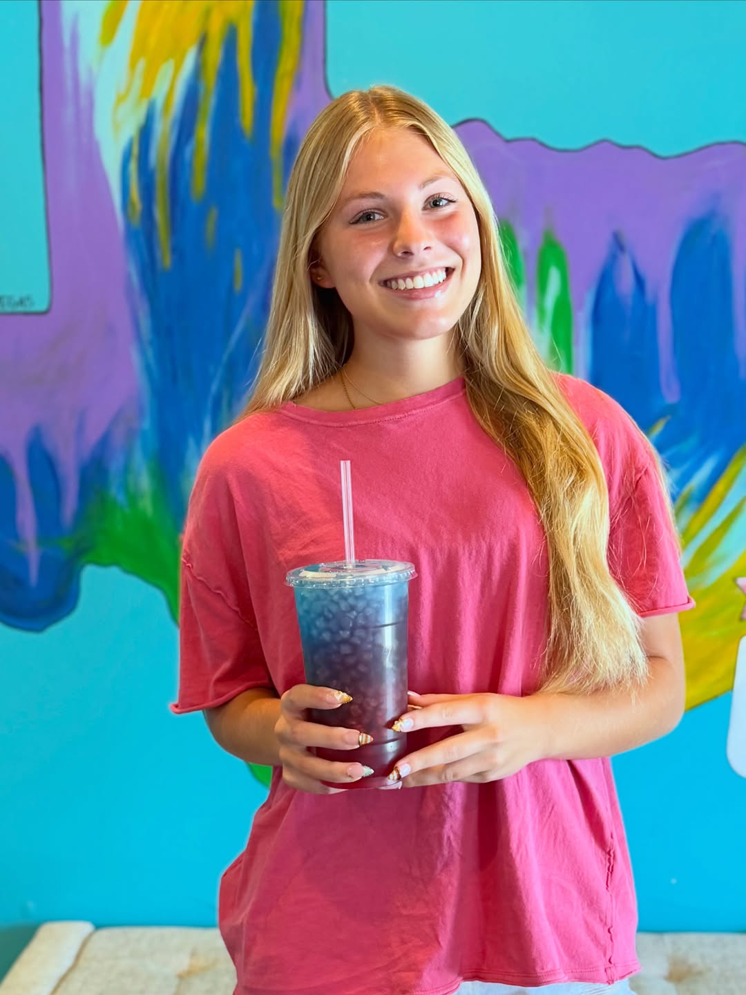An Imperial Nutrition guest holding a crafted tea
